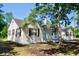Charming white brick home showcasing a cozy, traditional design with a prominent chimney at 401 S Nichols St., Nichols, SC 29581