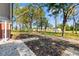 View of the front yard featuring lush trees and greenery, offering a tranquil setting at 401 S Nichols St., Nichols, SC 29581