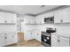 Stylish kitchen featuring new appliances, white cabinets, and modern finishes at 401 S Nichols St., Nichols, SC 29581