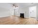 Spacious living room with light wood floors, fireplace, and bright windows at 401 S Nichols St., Nichols, SC 29581