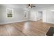 Bright living room featuring sleek wood floors, neutral walls, and windows that flood the space with natural light at 401 S Nichols St., Nichols, SC 29581