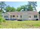 Charming single-story home with a painted brick exterior, complemented by a well-maintained yard at 401 S Nichols St., Nichols, SC 29581