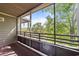 Screened balcony with views of lush greenery, offering a private outdoor space at 415 Ocean Creek Dr. # 2388, Myrtle Beach, SC 29572