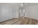 Neutral bedroom featuring a window and spacious closet with wood-look floors at 415 Ocean Creek Dr. # 2388, Myrtle Beach, SC 29572