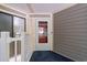 Well-lit entryway featuring a door with a glass pane and house number at 415 Ocean Creek Dr. # 2388, Myrtle Beach, SC 29572