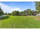 Expansive green lawn area with well-maintained landscaping and a building in the background at 415 Ocean Creek Dr. # 2388, Myrtle Beach, SC 29572