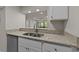 Kitchen featuring a stainless steel dishwasher, stainless sink, and granite countertops at 415 Ocean Creek Dr. # 2388, Myrtle Beach, SC 29572
