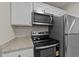 Modern kitchen featuring stainless steel appliances and granite countertops at 415 Ocean Creek Dr. # 2388, Myrtle Beach, SC 29572