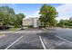 Spacious parking lot area with a building in the background, providing ample parking spaces at 415 Ocean Creek Dr. # 2388, Myrtle Beach, SC 29572