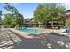 Outdoor swimming pool surrounded by lounge chairs, perfect for relaxation at 415 Ocean Creek Dr. # 2388, Myrtle Beach, SC 29572
