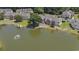 Aerial view of the community featuring a pond and manicured landscaping surrounding the well-maintained homes at 4280 Santolina Way # C, Murrells Inlet, SC 29576