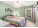 Serene bedroom with soft green walls, large window, and comfortable bed at 4280 Santolina Way # C, Murrells Inlet, SC 29576