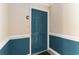 Interior view of a teal apartment entrance door with white trim and baseboard at 4280 Santolina Way # C, Murrells Inlet, SC 29576