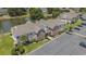 The exterior view showcases the building's architecture, surrounding landscaping, and ample parking space at 4280 Santolina Way # C, Murrells Inlet, SC 29576