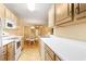 Well-lit kitchen featuring white countertops, appliances, and light wood cabinets at 4280 Santolina Way # C, Murrells Inlet, SC 29576