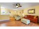 Bright living room featuring wood floors open to the kitchen and dining area at 4280 Santolina Way # C, Murrells Inlet, SC 29576
