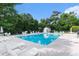 Community pool surrounded by lounge chairs and lush greenery, offering a resort-like experience at 4280 Santolina Way # C, Murrells Inlet, SC 29576