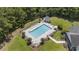 An aerial view of the fenced community pool with ample seating and landscaped grounds, perfect for relaxation at 4280 Santolina Way # C, Murrells Inlet, SC 29576