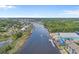 Scenic aerial view of homes and boat docks along a beautiful waterway at 4319 Grande Harbour Blvd., Little River, SC 29566