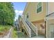 Two-story beach home showing the exterior stairs and the entrance into the living area at 4319 Grande Harbour Blvd., Little River, SC 29566