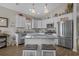 Bright kitchen featuring white cabinets, stainless steel appliances, and a granite-topped island with bar seating at 4319 Grande Harbour Blvd., Little River, SC 29566