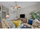 Welcoming living room with a TV, a large palm, tasteful decorations, and a great space to entertain at 4319 Grande Harbour Blvd., Little River, SC 29566