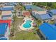 Aerial view of a private community pool with lounge chairs and well-manicured landscaping at 4319 Grande Harbour Blvd., Little River, SC 29566