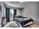 Comfortable bedroom with natural light from the window and carpeted floor at 4486 Little River Inn Ln. # 2106, Little River, SC 29566