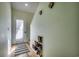 Bright entryway with shoe storage, a textured rug, and a white-framed door leading outside at 4486 Little River Inn Ln. # 2106, Little River, SC 29566