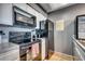 Well-equipped kitchen with black appliances, stylish countertops, and modern cooking range at 4486 Little River Inn Ln. # 2106, Little River, SC 29566
