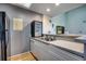 A modern kitchen with updated countertops, stainless steel sink, and compact beverage cooler at 4486 Little River Inn Ln. # 2106, Little River, SC 29566