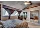 Bedroom with angled ceiling, TV, and a mirror reflecting a view of the room with bed and furnishings at 4486 Little River Inn Ln. # 2106, Little River, SC 29566