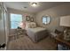 Cozy bedroom featuring large window for ample light, comfortable bed and stylish decor at 45 Woodhaven Dr. # D, Murrells Inlet, SC 29576