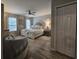 Spacious bedroom with elegant furnishings, soft color palette, and ample natural light at 45 Woodhaven Dr. # D, Murrells Inlet, SC 29576