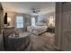 Spacious bedroom with elegant furnishings, a fan, soft color palette, and ample natural light at 45 Woodhaven Dr. # D, Murrells Inlet, SC 29576