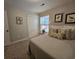 Bright bedroom with comfortable bed, natural light from window and door to the closet at 45 Woodhaven Dr. # D, Murrells Inlet, SC 29576