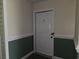 White door with letter D and lock at 45 Woodhaven Dr. # D, Murrells Inlet, SC 29576