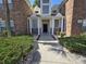 Welcoming entryway with meticulously maintained landscaping, leading to a beautifully designed condo at 45 Woodhaven Dr. # D, Murrells Inlet, SC 29576