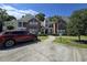 Inviting condo exterior features brick accents, manicured landscaping, and a convenient parking space at 45 Woodhaven Dr. # D, Murrells Inlet, SC 29576