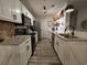 Updated kitchen features granite countertops, stainless steel appliances, and ample cabinet space at 45 Woodhaven Dr. # D, Murrells Inlet, SC 29576