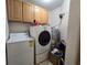 Laundry room with appliances and cabinets at 45 Woodhaven Dr. # D, Murrells Inlet, SC 29576