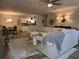 Spacious living room featuring a comfortable sectional sofa, adjacent to dining area and modern kitchen at 45 Woodhaven Dr. # D, Murrells Inlet, SC 29576