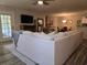 Bright living room showcasing an open floor plan connecting to dining area and outdoor access at 45 Woodhaven Dr. # D, Murrells Inlet, SC 29576