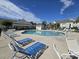 Community pool with blue lounge chairs at 45 Woodhaven Dr. # D, Murrells Inlet, SC 29576