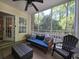 Inviting screened porch with a ceiling fan at 45 Woodhaven Dr. # D, Murrells Inlet, SC 29576