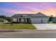 Charming single-story home with a manicured lawn, two-car garage, and welcoming front entrance at 459 Lifestyle Court, Surfside Beach, SC 29575