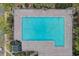 Aerial view of a sparkling blue community pool with surrounding pavers and lounge area at 4826 Keel Ct., Myrtle Beach, SC 29579
