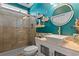 Colorful bathroom with a glass shower and a stylish vanity at 4826 Keel Ct., Myrtle Beach, SC 29579