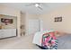 Bright bedroom with light-colored walls and floors, a ceiling fan, and ample storage at 4826 Keel Ct., Myrtle Beach, SC 29579