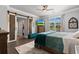 Comfortable bedroom with a sliding barn door closet and view of backyard at 4826 Keel Ct., Myrtle Beach, SC 29579
